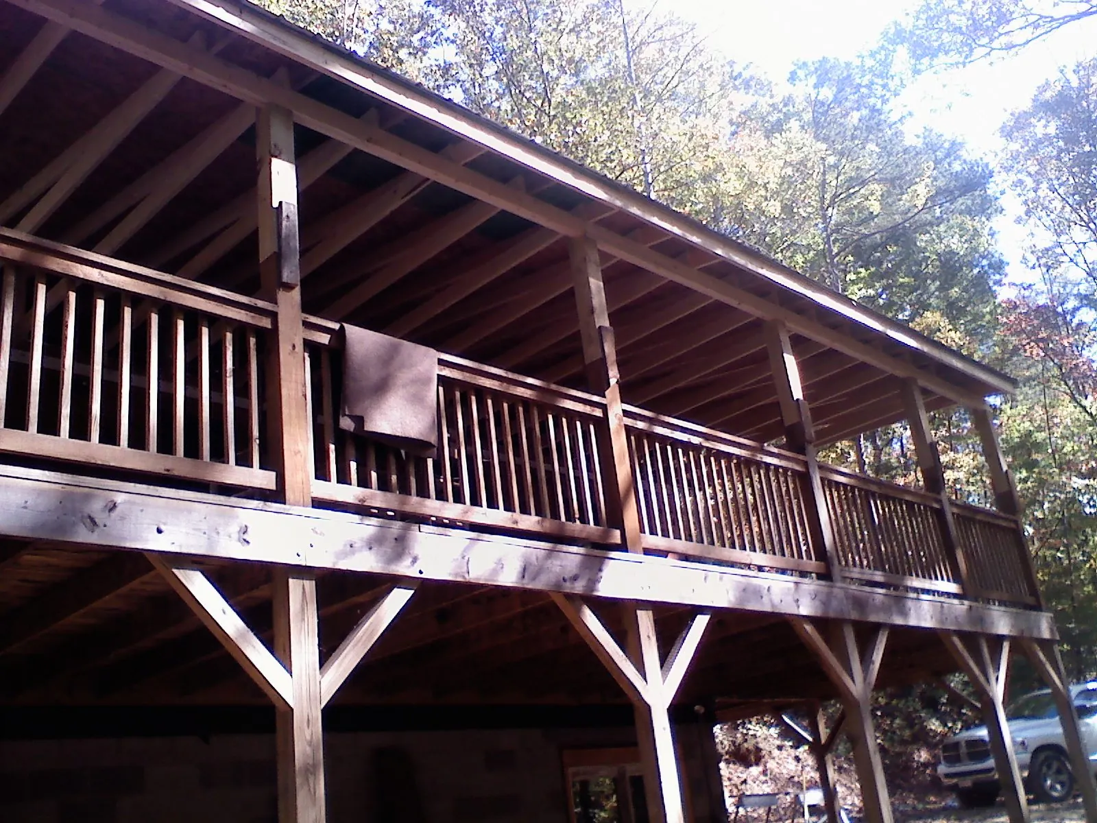 Timber framing under a new elevated porch and deck — Roof Leak Repair in West Granby by Roofing Brothers